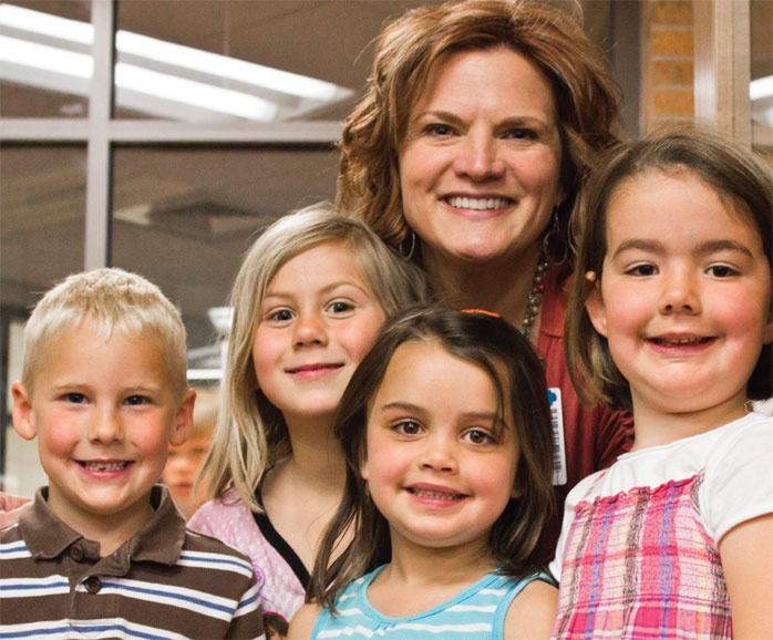 teacher with happy students
