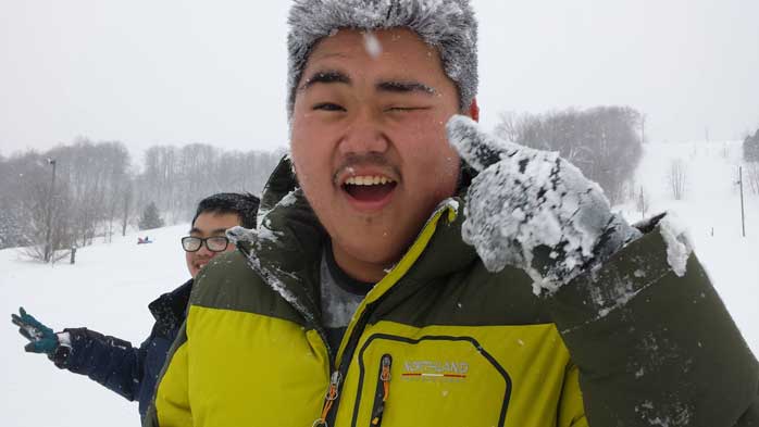 International students enjoying the snow
