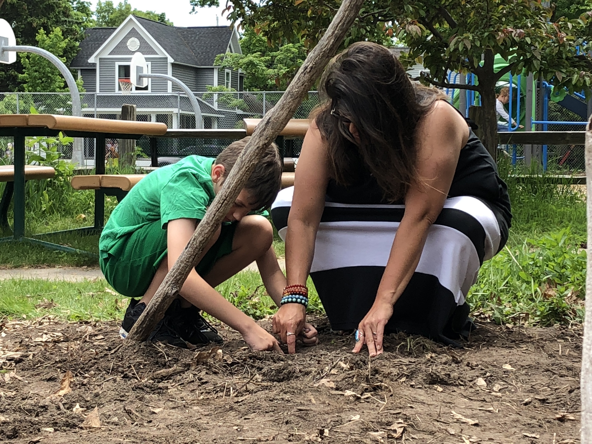 central grade school student planting with three sisters