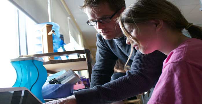 CK-teacher-with-student-web-banner Teacher assisting student on project