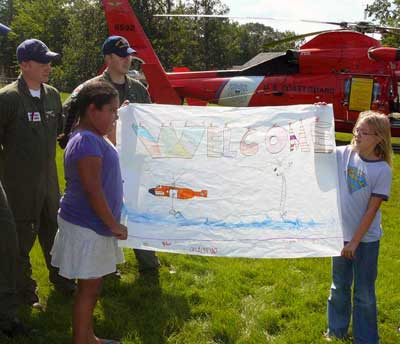 Elementary school students welcome US Coast Guard volunteers